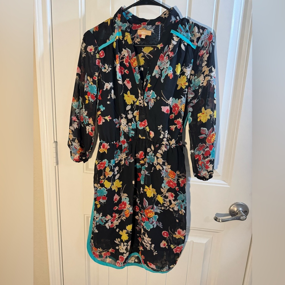 Tamara dress size small. Floral colorful print with teal blue stripe